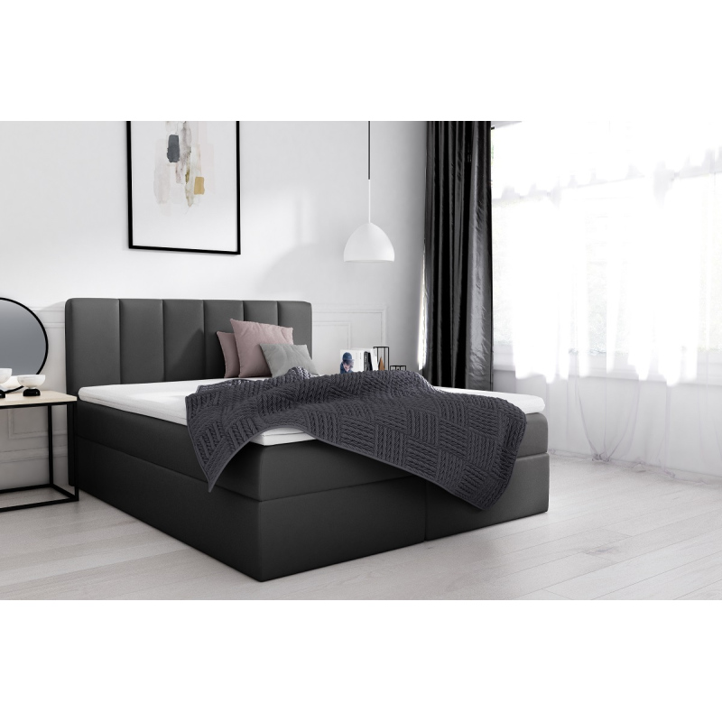 Extravagantná čalúnená posteľ Sven s úložným priestorom čierna eko koža 140 x 200 + topper