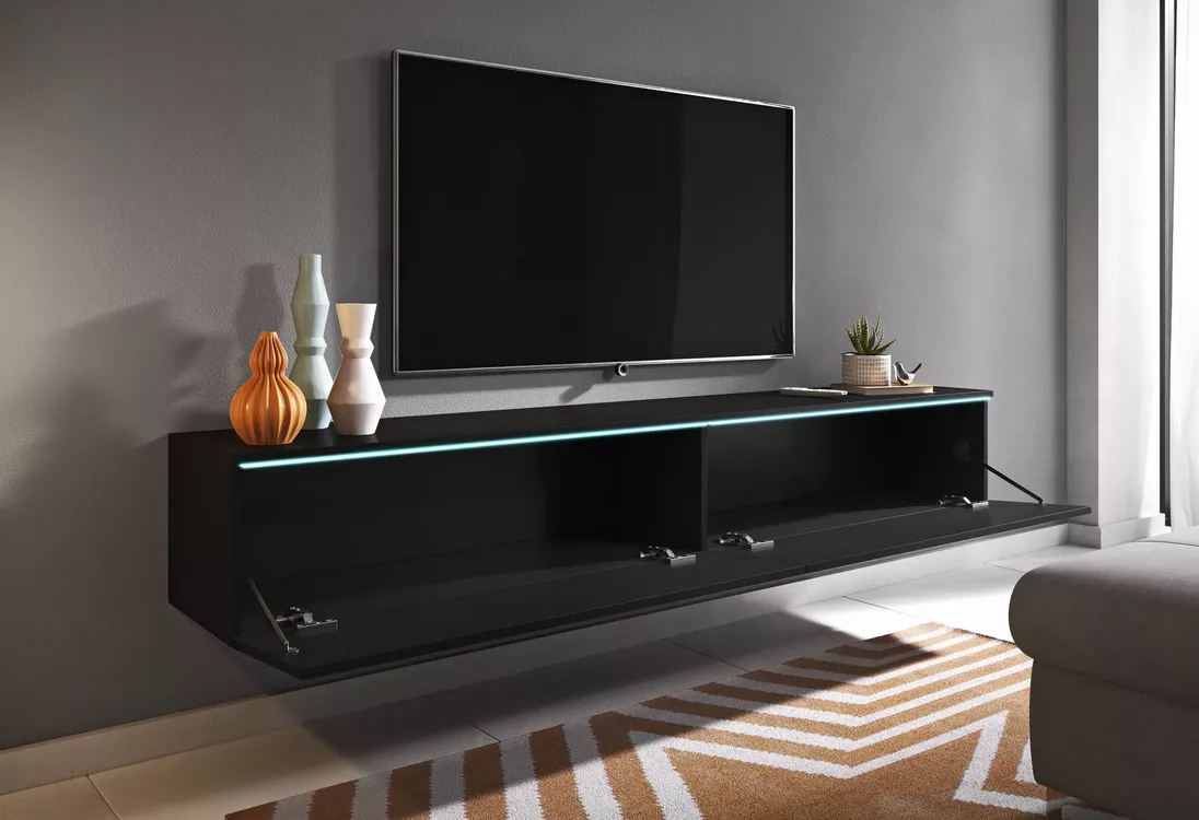 Závesný TV stolík Ceriee s otvorenými výklopnými dvierkami a pohľadom do vnútorného úložného priestoru